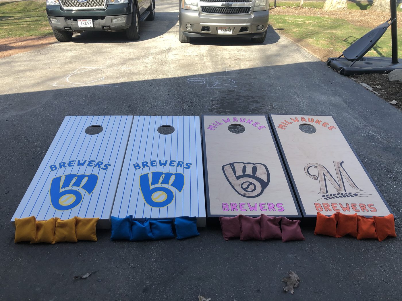 Custom cornhole boards with Milwaukee Brewers pinstripe design and bags