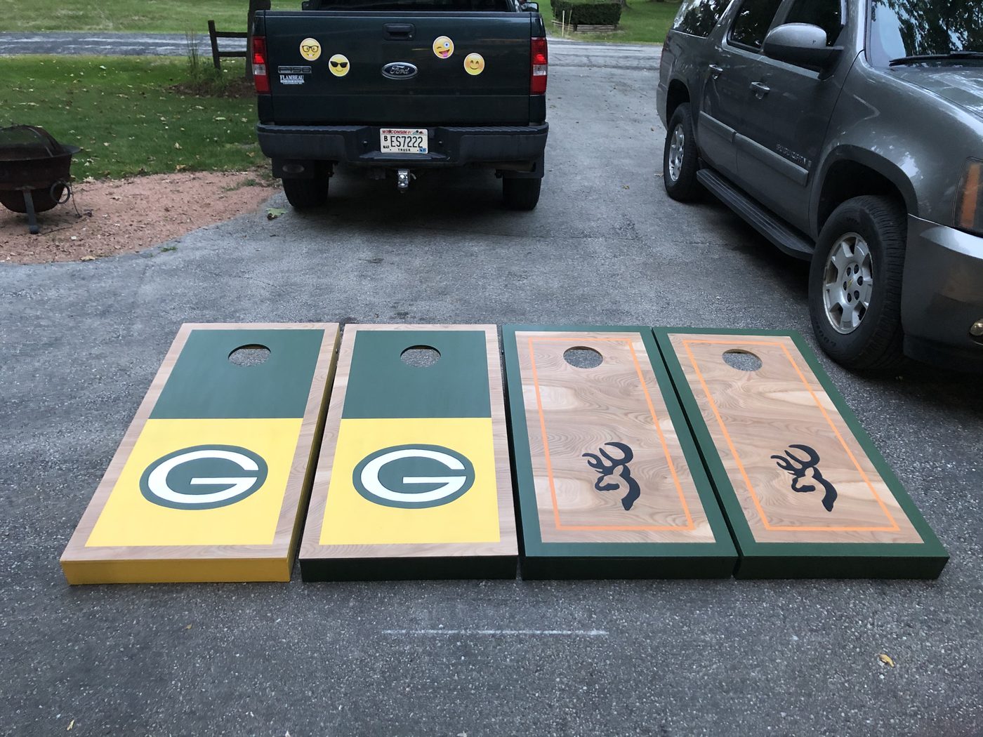 Custom cornhole boards with Green Bay Packers and camo hunting design