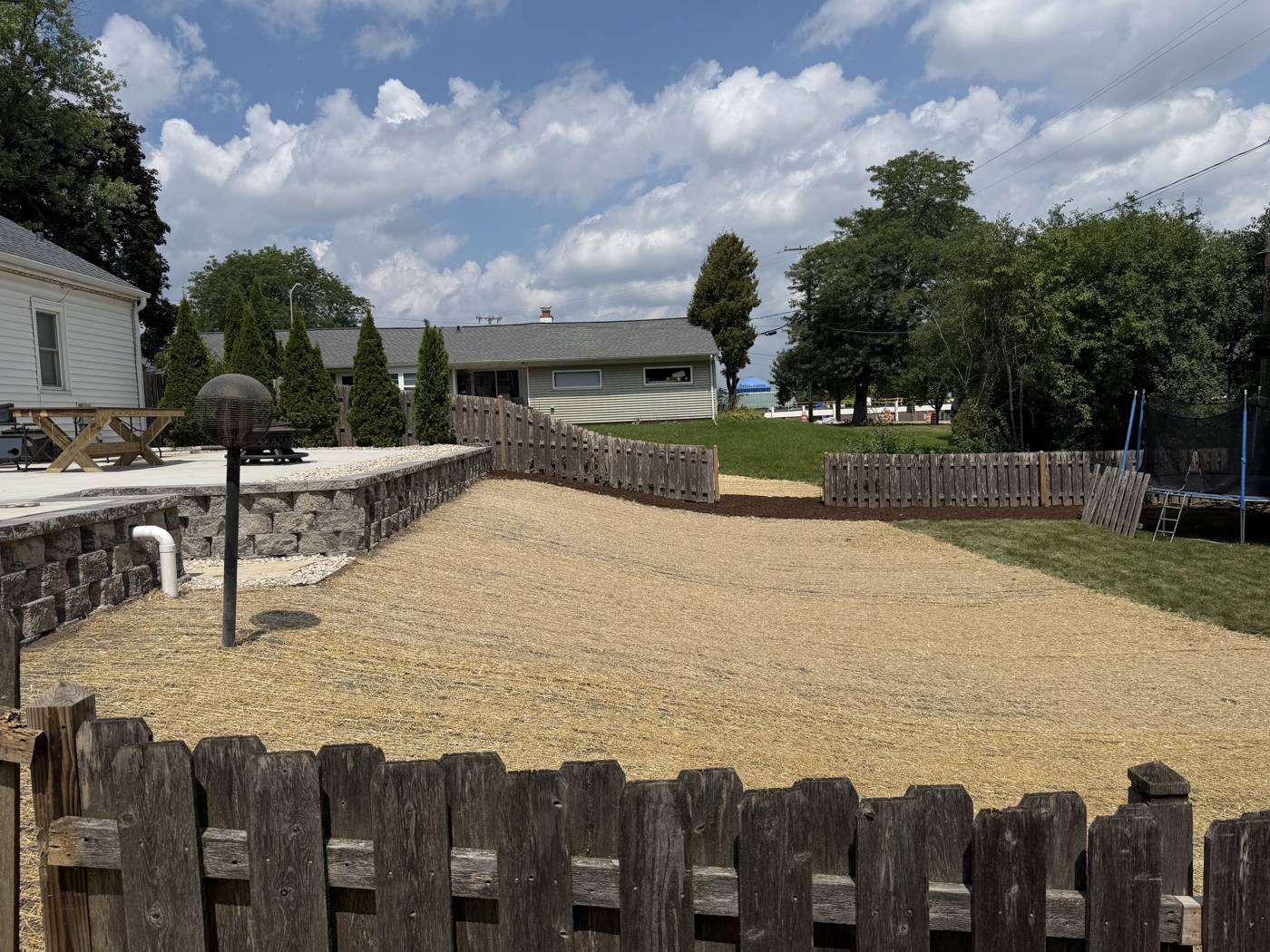 Yard regrading for drainage improvement