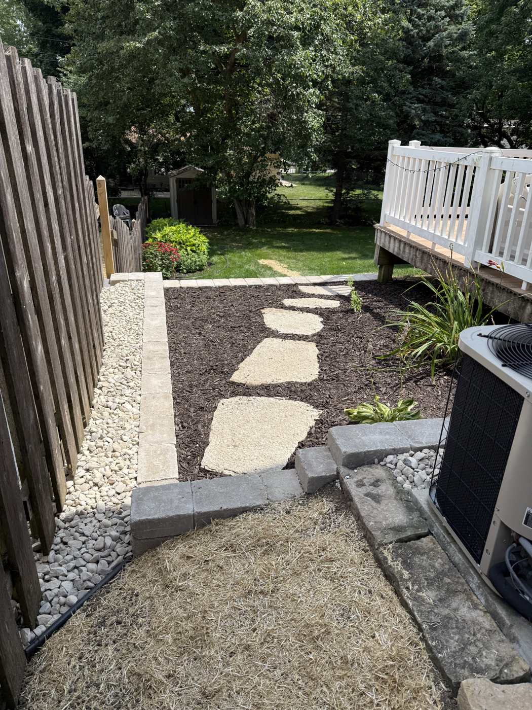 Retaining wall and mulch bed installation