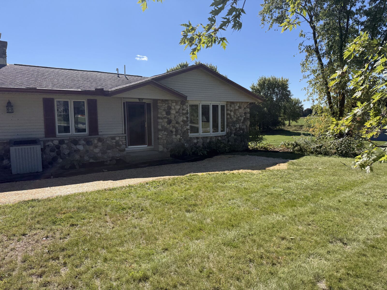 Front yard cleaned up with fresh topsoil and seed along the house, after