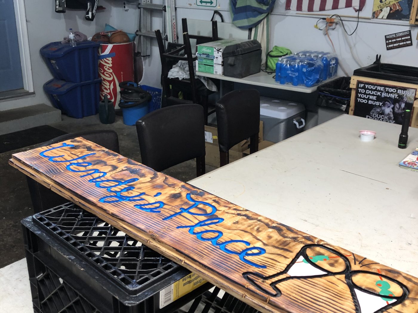 Custom burnt-wood sign reading Life's a Beach with a martini glass design