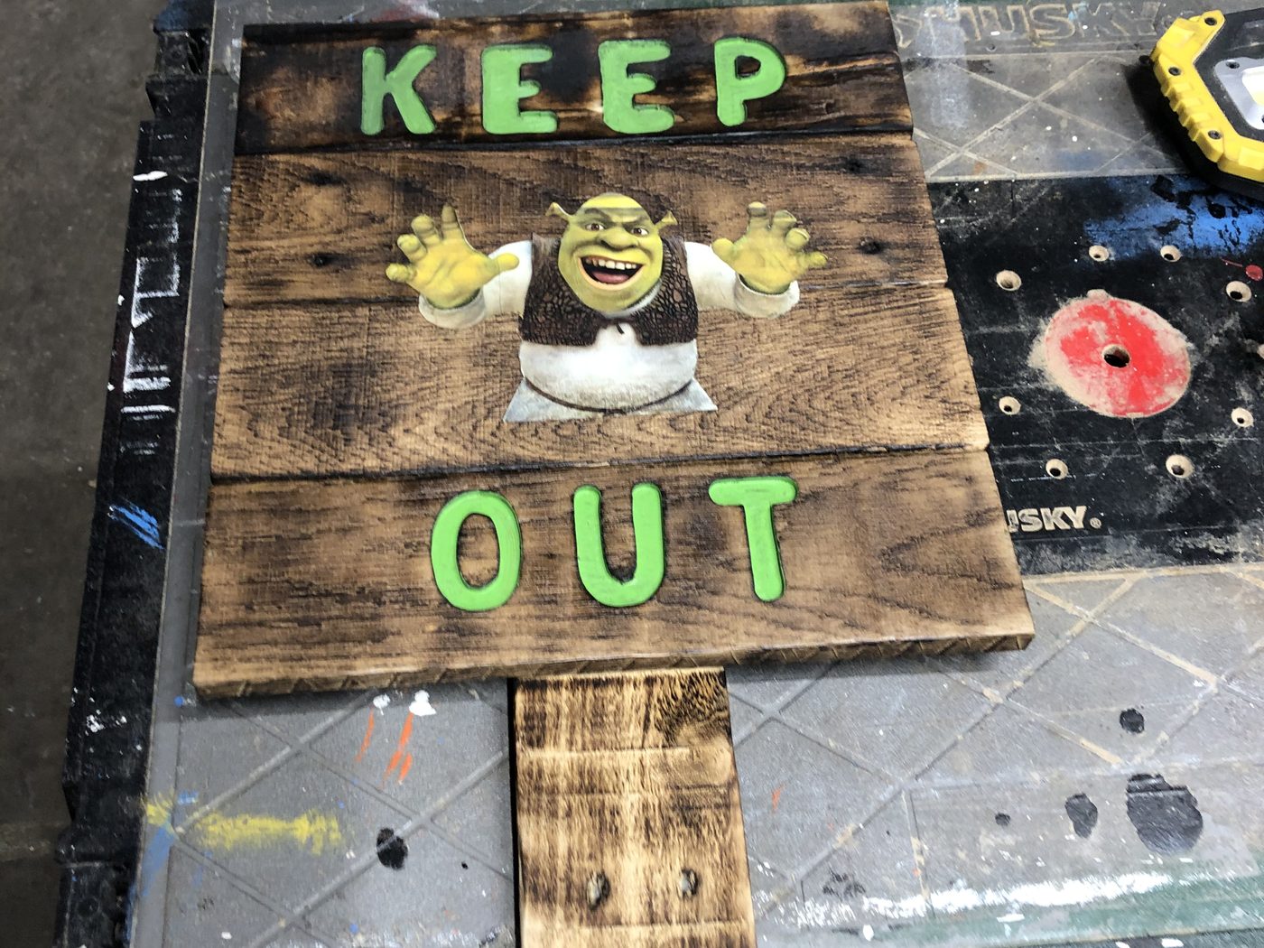 Custom novelty wood sign reading Keep Out with a cartoon character