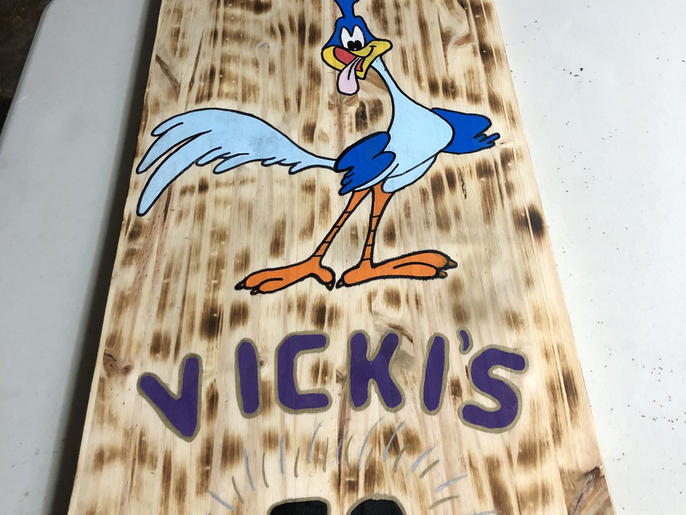 Custom personalized birthday sign with a cartoon roadrunner character